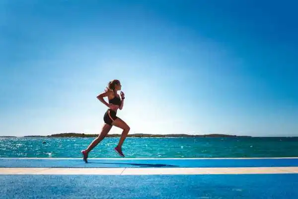 Woman running showing strong leg muscle Hungerford